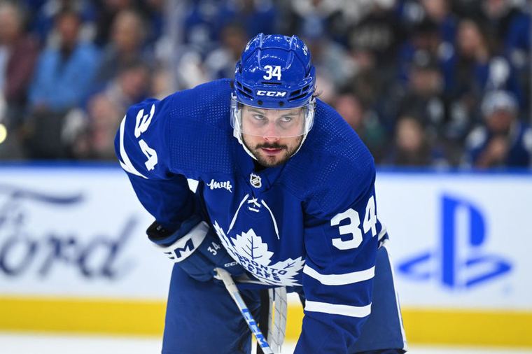 Auston Matthews lining up on the ice in a Toronto Maple Leafs jersey